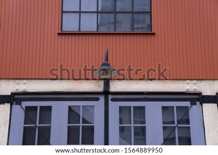 Windows and light and brick facade of a historical building in Yaletown, Vancouver, Canada