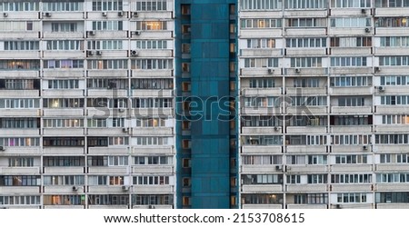 Windows of multi-storey panel residential buildings in a residential area of a large city.