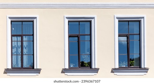 Windows in a multi-story building as a background.