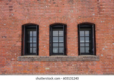 Windows On Wall At The Red Brick Warehouse In Yokohama, Japan. The Warehouse Is An Artsy Shopping Center, The Home Of Some Excellent Restaurants.