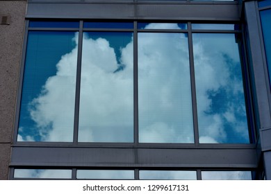 Windows with reflection of sky and clouds