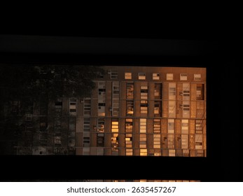 Windows of a residential building at sunset with warm reflections