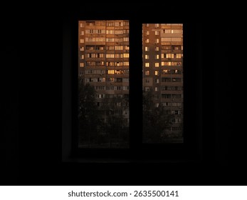 Windows of a residential building at sunset with warm reflections