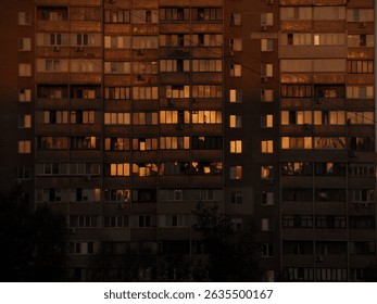 Windows of a residential building at sunset with warm reflections