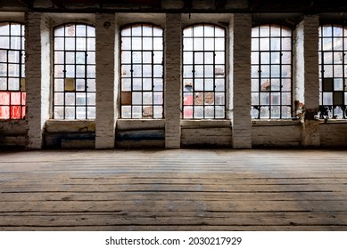 Windows Of A Ruined Factory Wall With Old And Broken Mat Glass And Corroded Iron In A Brick Wall In A Lost Place In Germany