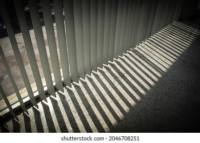 Windows with vertical blinds, Detail of the interior texture with lights and shadows on the floor, The concept background