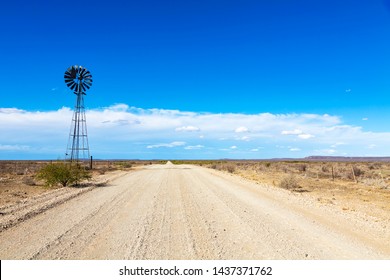 Windpump next to the gravel road in the Karoo