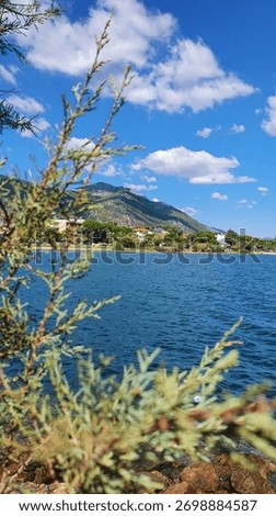 Wind-ruffled sea surface with small whitecaps under a bright Mediterranean sky.
