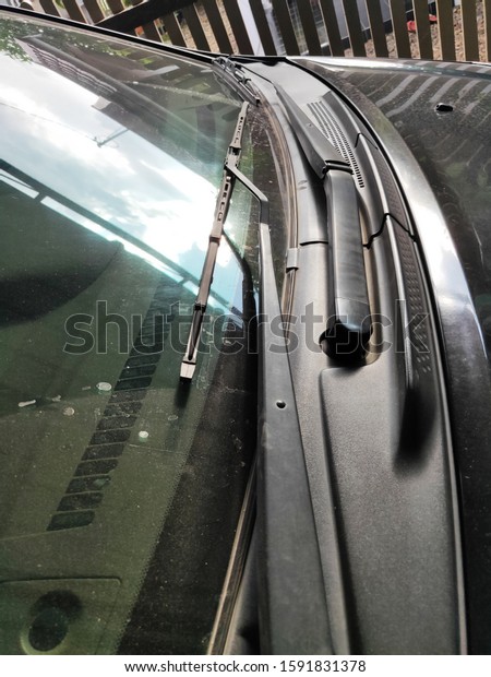 A
windscreen wiper or windshield wiper is a device used to remove
rain, dust and  snow from a windscreen or
windshield