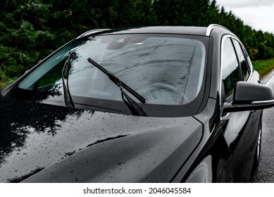 Windscreen Wipes Cleaning Windshield Glass On Rainy Day.