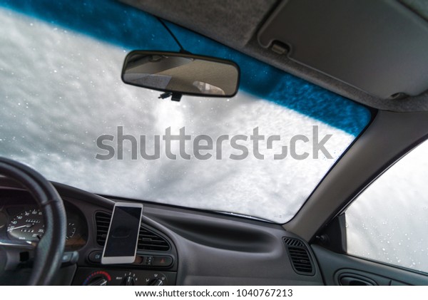 windshield of car in soap. car wash concept. view\
from inside