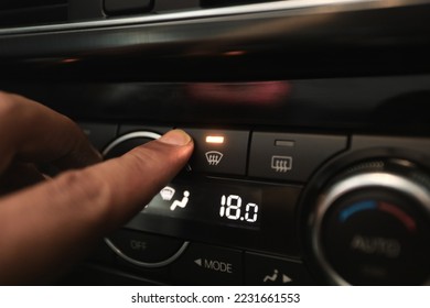 Windshield Defogger Icon on Car.  hand pressing the defogger button to remove the fog on the windshield - Shutterstock ID 2231661553