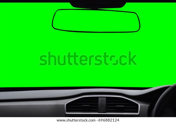 Windshield and rear\
view mirror ,View inside the car with green scree Isolated on\
background with clipping\
path.