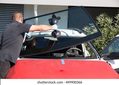 Windshield Replacement, Man Is Changing Windscreen On A Car