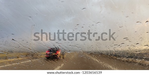 Windshield view at road bad\
weather.