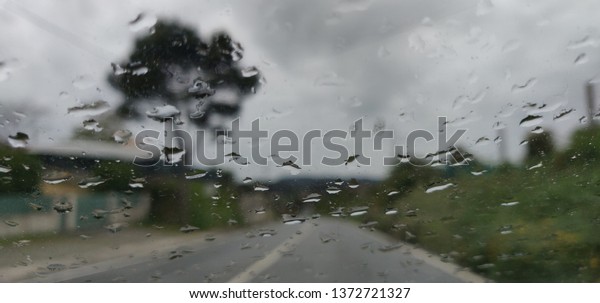 Windshield view of road bad\
weather.