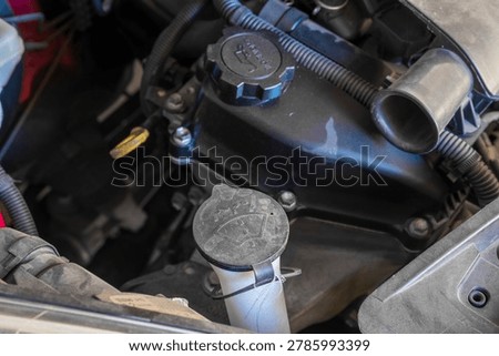 Windshield Washer Fluid Cap in Car Engine Bay