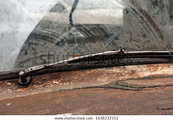 Windshield and\
wipers of an old Soviet car close-up.\
