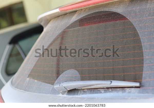 Windshield-Rear Dirty car Dirty car in the\
dusty view of the windshield in the rear view\
close-up.