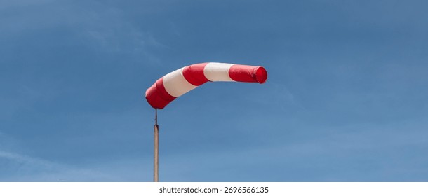 Windsock Against Blue Sky. Basic Indicator of Wind Speed and Direction.