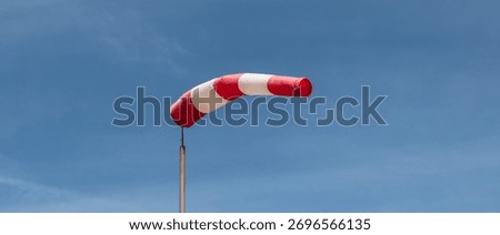 Windsock Against Blue Sky. Basic Indicator of Wind Speed and Direction.