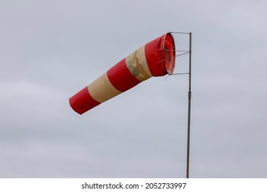 Windsock indicator of wind on runway airport. Wind cone indicating wind direction and force.