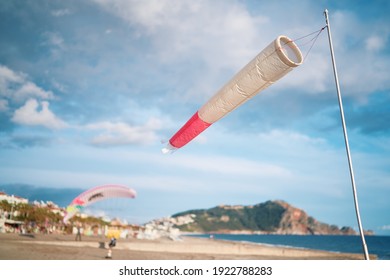 Windsock or windbag, wind direction indicator on the beach. Paragliding in Alanya.