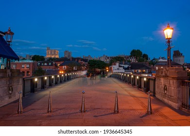 WINDSOR, BERKSHIRE, UK - JULY 17, 2010:   View Of The Bridge Over The River Thames Looking Toward Windsor Castle At Night