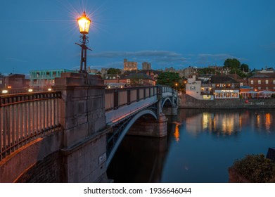 WINDSOR, BERKSHIRE, UK - JULY 17, 2010:   View Of The Bridge Over The River Thames Looking Toward Windsor Castle At Night