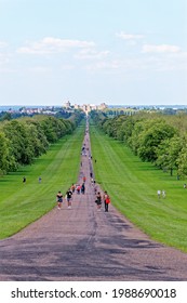 Windsor Castle viewed down the Long Walk with people enjoying the view and warm summer sun Windsor Berkshire United Kingdom - 31th of May 2021