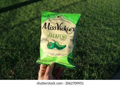 Windsor, CO USA - October 1, 2021: Small Bag Of Miss Vickie's Brand Kettle Cooked Potato Chips. Snack Bag On A Sunny Day With Grass Background.                             