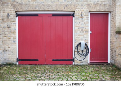 Windsor, United Kingdom - October 1, 2019: Tesla Supercharge Station On The Property Near Windsor Castle. It's Outside The Garage And Is Weatherproof.