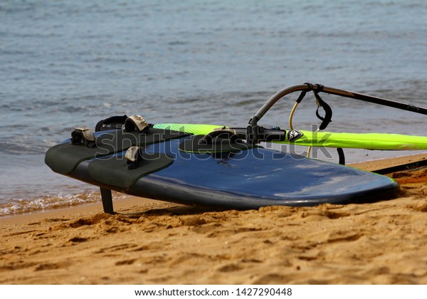 windsurf board\
on the sand, spending life during a holiday to taste freedom and\
adventure  at Pattaya beach,\
Thailand.