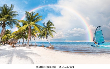 Windsurfer surfing the wind on sea waves at  paradise sunny beach with palms and turquoise sea. Amazing rainbow in the background Summer vacation and tropical beach concept - Cancun, Mexico - Powered by Shutterstock