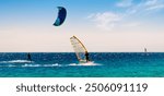 windsurfers and kitesurfers ride in the Red Sea in Sharm El Sheikh