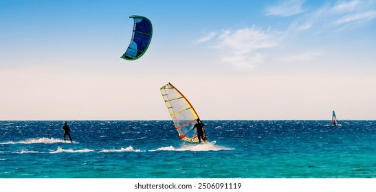 windsurfers and kitesurfers ride in the Red Sea in Sharm El Sheikh - Powered by Shutterstock