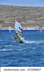 Windsurfing In The Blue Waters Of Alacati, Cesme, Turkey