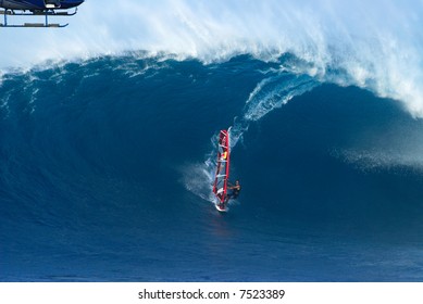 Windsurfing At Jaws In Maui Hawaii With Helicopter Looking On