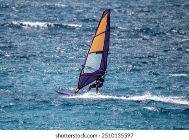 Windsurfing - like colorful butterflies against the blue sea in the bay on the island of Crete in Greece - Powered by Shutterstock