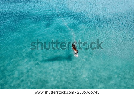 Windsurfing on blue sea in summer