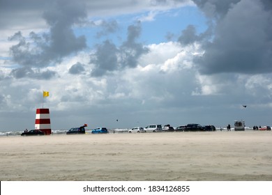 Windswept beach, blue sky and white clouds