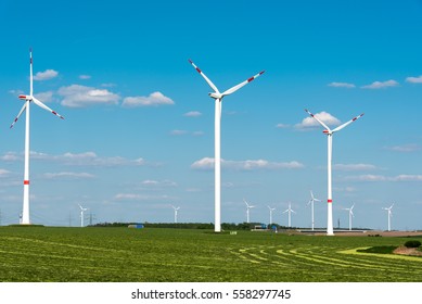 Windwheels in a grass field seen in Germany