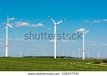 Windwheels in a grass field seen in Germany