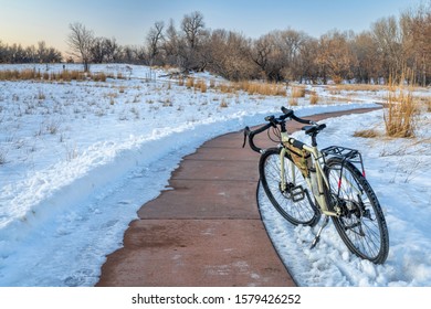 Windy Bike Trail With A Bicycle On Kickstand In Winter Sunset Scenery - Poudre River Trail In Fort Collins, Colorado, Recreation And Commuting Concept