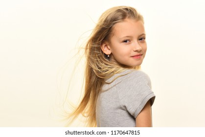 windy hair. small girl has windy hair. windy hair of little cute girl isolated on white, copy space. smiling girl with long windy hair. carefree