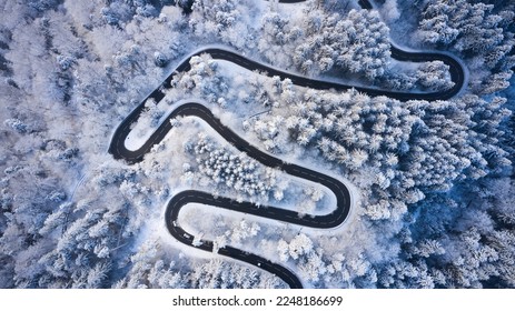 windy road in winter with snow aerial - Powered by Shutterstock