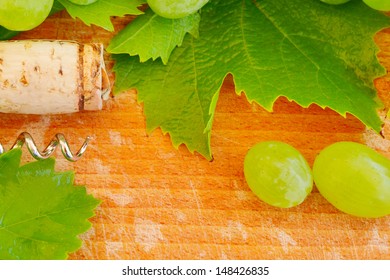 Wine background with cork, grape and leaf