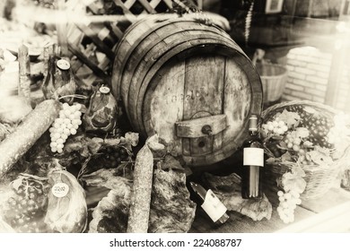 Wine barrel and dried meat assortment in vintage setting