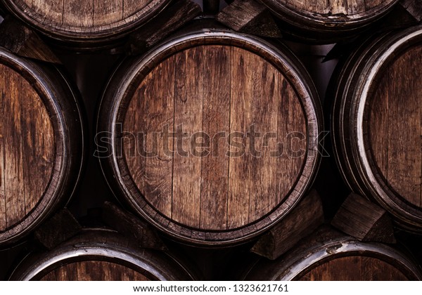 Wine barrels, close up.\
Wine casks at the winery. Stacked old Wine barrels at the german\
winery.