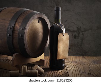 Wine Bottle With Barrel And Old Paper Label